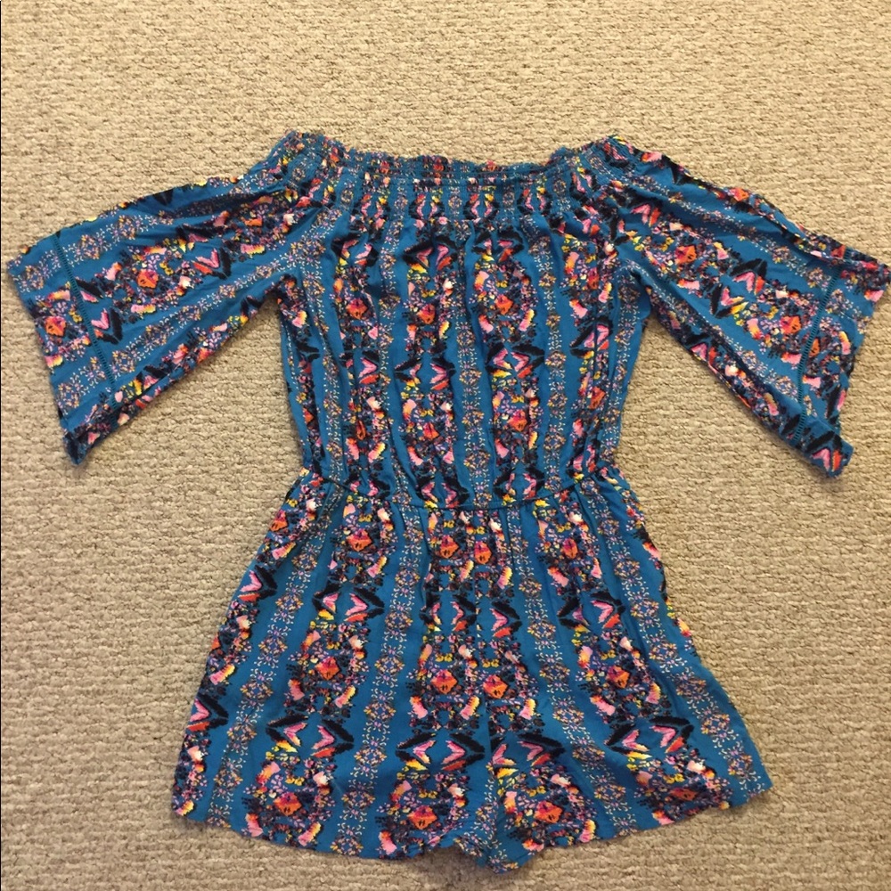Romper with pockets off the shoulder if desired.
